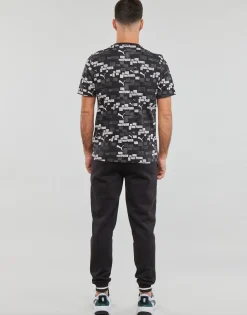 Puma T-shirts & Polos^- ESS+ LOGO LAB AOP TEE