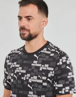 Puma T-shirts & Polos^- ESS+ LOGO LAB AOP TEE